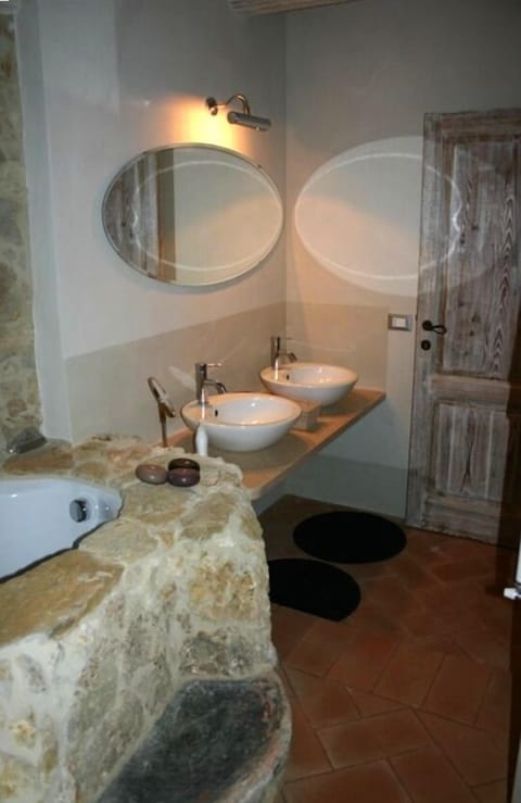 Upstairs bathroom with rock-sunken tub