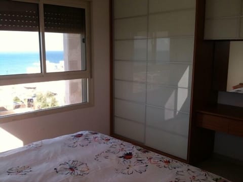 Master bedroom (queen bed) with view of sea, plasma TV and en-suite bathroom