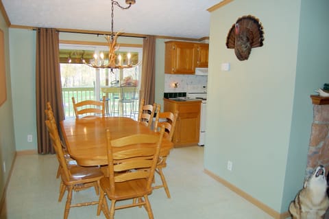 Dining area leads to back deck.