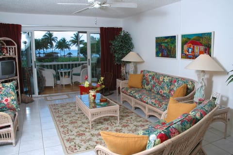 Living Room And Porch With View Of The Pool And Ocean  