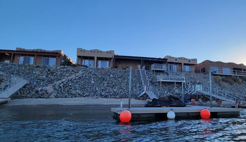 View of house, dock and beach from river 