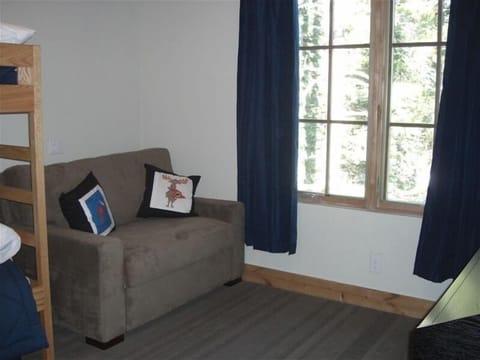 Kids Room w/ sleeper sofa on main floor with kitchen and living room