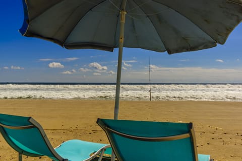 On the beach, sun loungers