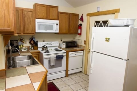 Kitchen at Spruce Ridge with tiled countertops