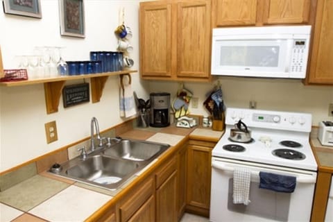 Another view of the kitchen and ample cabinet space