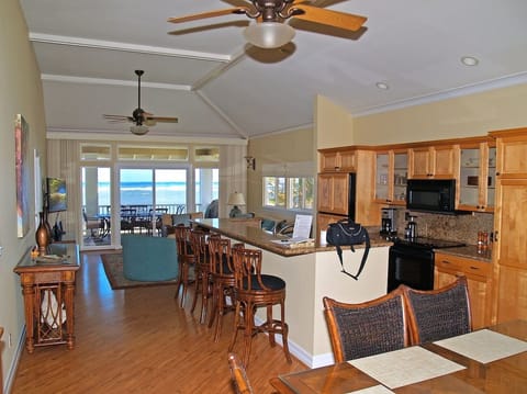 The beautiful Kitchen has granite counters and an island bar.