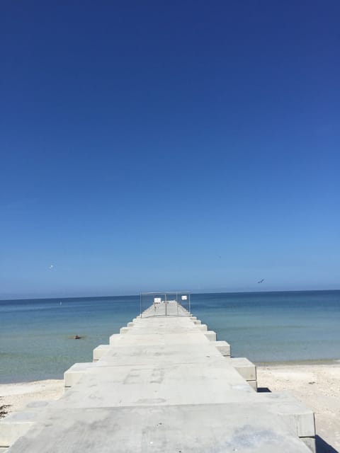 On the beach, sun loungers, beach towels