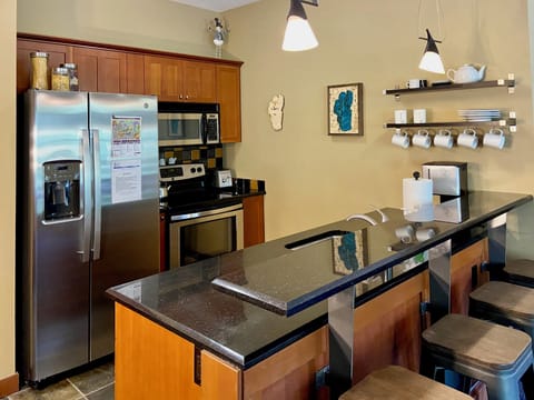 Full kitchen with modern appliances and stocked essentials