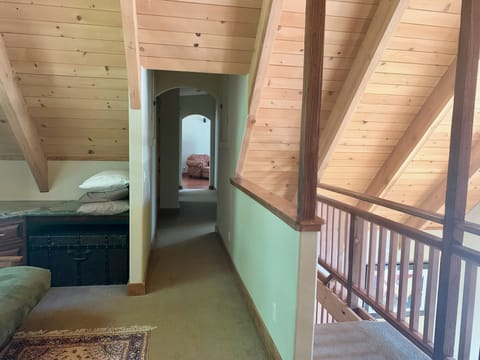 Hallway from loft to second living room and bedroom and bath #3 