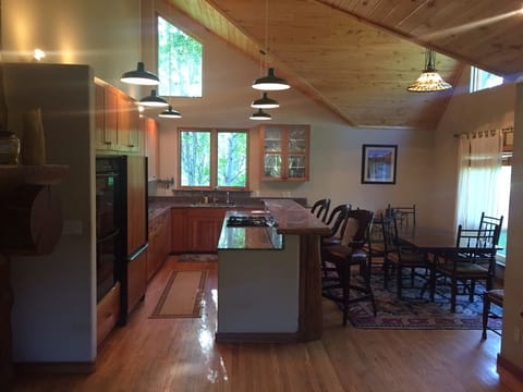 Kitchen. Seats 8 at table . 4 at bar. 2 ovens. 
