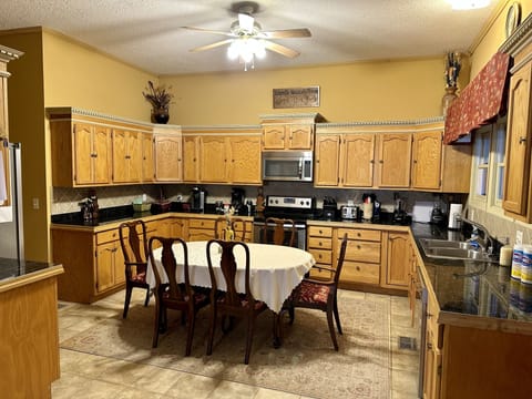 Large fully stocked eat-in kitchen.