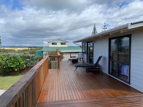 Lounge & Master bedroom flow to deck with sweeping Doubtless Bay views