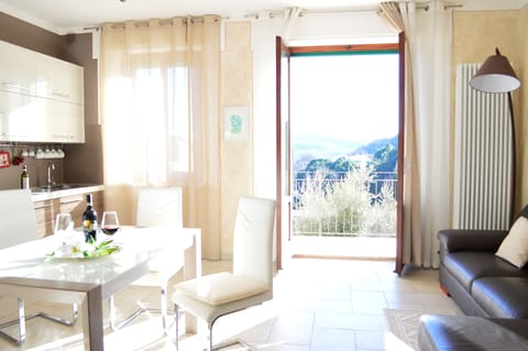 Living room with full equipped kitchen and balcony