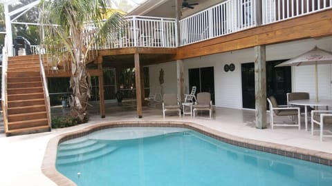 Pool lanai area with shallow seating, screened and private