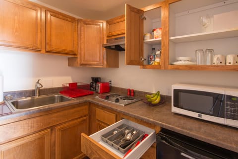 Fully stocked large kitchenette with 2 small refrigerators for long term stays