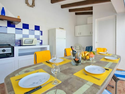 Furniture, Property, Table, Cabinetry, Dishware, Azure, Countertop, Kitchen, Interior Design, Orange