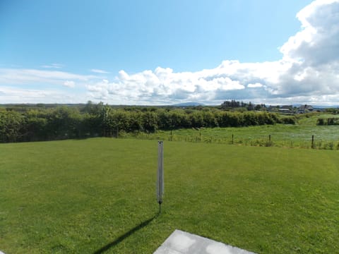 Garden laid to lawn with far reaching countryside views