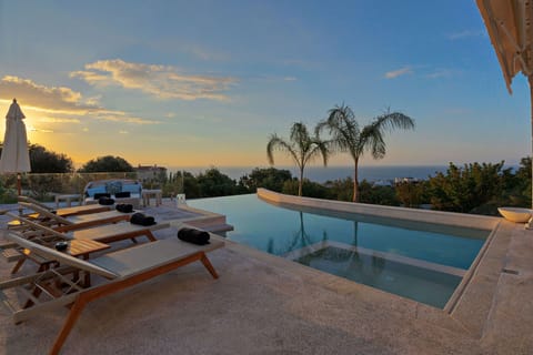 A heated pool, sun loungers