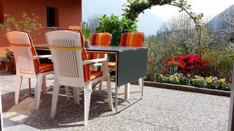 Backyard patio with view on the village of Golino and mountains