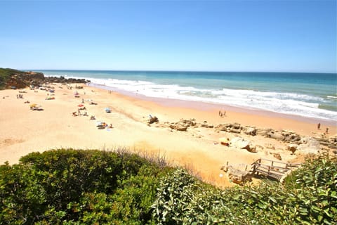 On the beach, sun loungers, beach towels