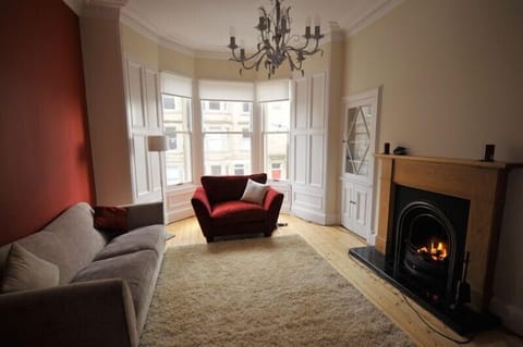cosy lounge with open fire and bay window