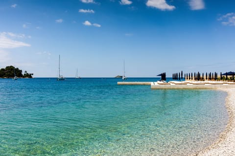 Beach nearby, sun loungers