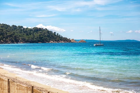 On the beach, sun loungers, beach towels