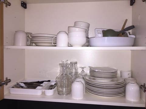 Microwave, dishwasher, coffee/tea maker, cookware/dishes/utensils