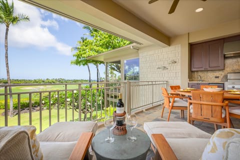 Unwind with cocktails on this intimate seating nook on the lanai—framed by tropical views and ocean breezes.