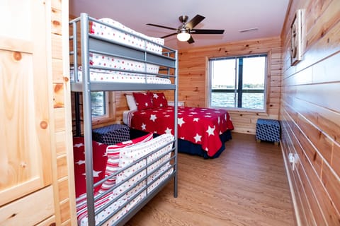 Here's one of the 3 BR-BA suites with both Queen bed + Twin  Bunkbeds.