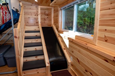 Close-up of staircase and slide that accesses the Kid's Play Loft.