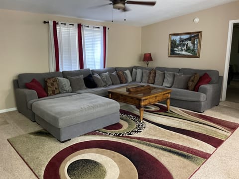 Spacious Living room with massive sectional couch.