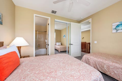 Guest bedroom features one full and one twin bed