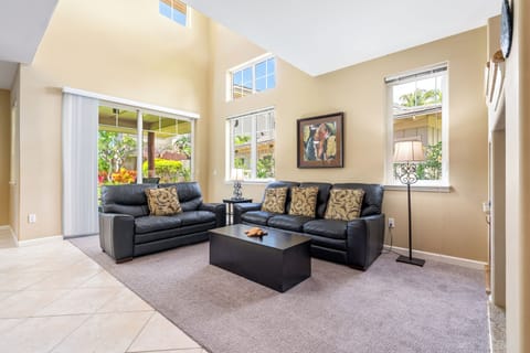 Sunlit, airy living room with sofas