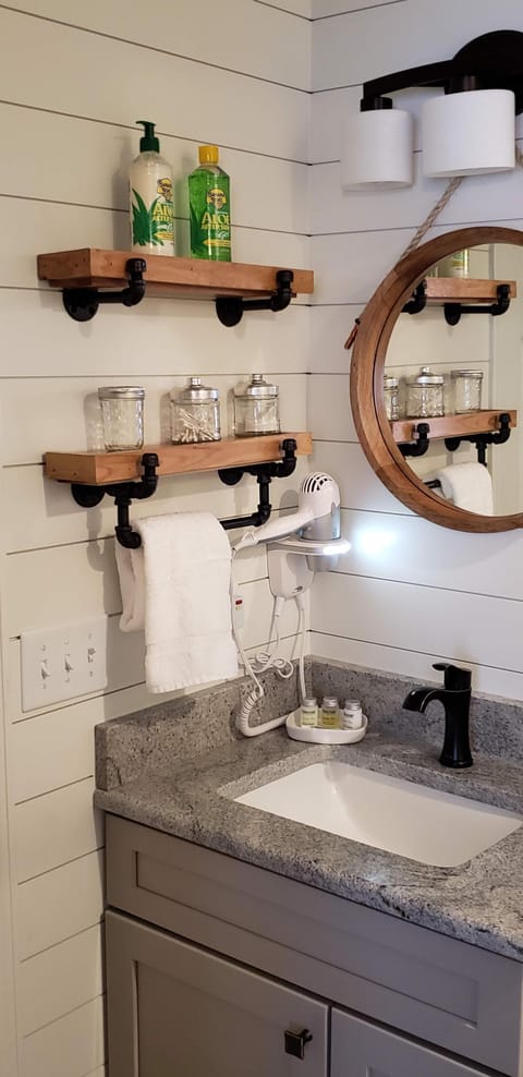 Combined shower/tub, hair dryer, towels, soap