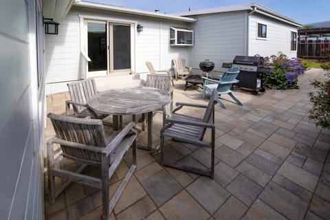 The back patio offers seating and a wonderful place to enjoy the afternoon sun.