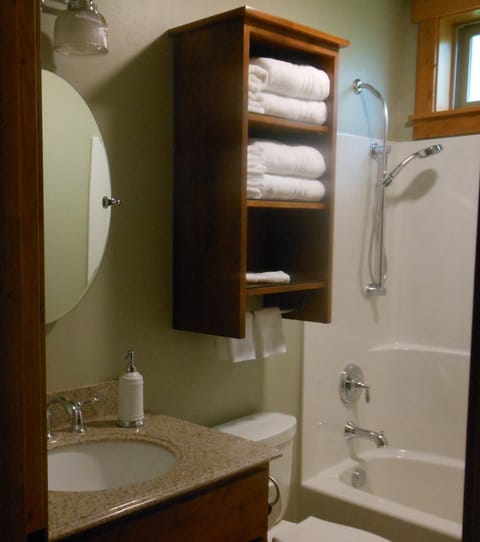 Private tub/shower in master bath suite.