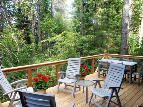 Sitting and dining areas on the large private deck overlooking the creek