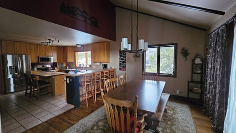 Kitchen/Dining includes a bar that seats 4 and a kitchen island that seats 2