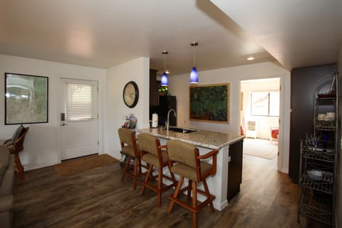 Great room from living room, kitchen and on to back, sunny bedroom; forest view!