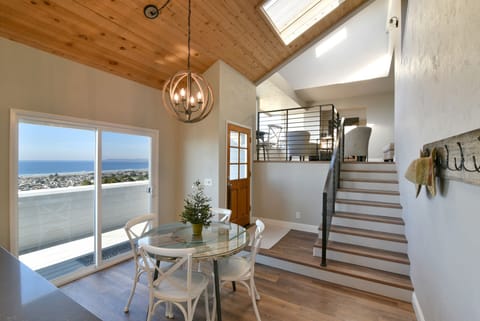 Enter through the front door into the dining area, stairs to living area and bed