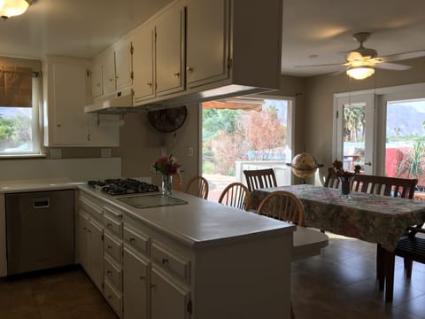 Functional Kitchen with seating for 12 or more.