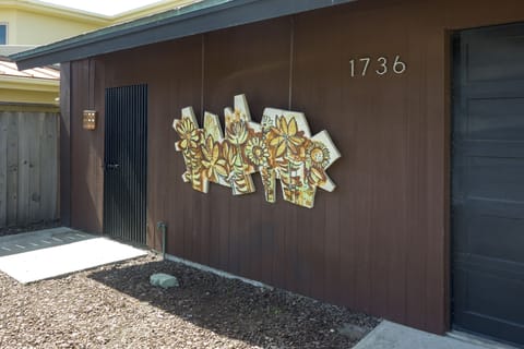 Wall art welcomes you to the home as you get ready to enjoy your relaxing stay