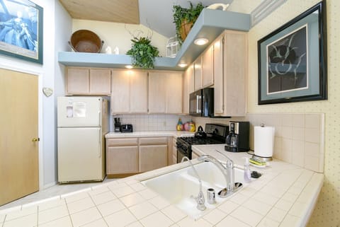 The kitchen offers a large counter space for prepping meals and a pantry.