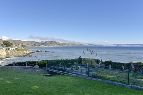 Lawn area off back deck. Guests are only allowed to use area in front of deck.