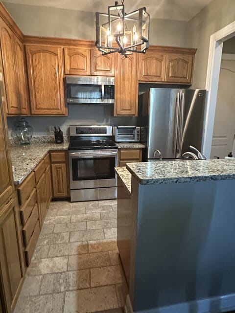 Kitchen with granite counters, stainless steel appliances and a reverse osmosis.
