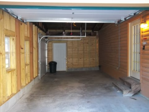 Garage Room for one car and motorcycle. TWO GARAGE DOORS