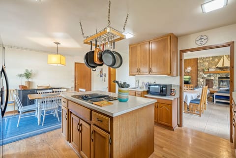 The kitchen with center cooking station island makes entertaining a breeze