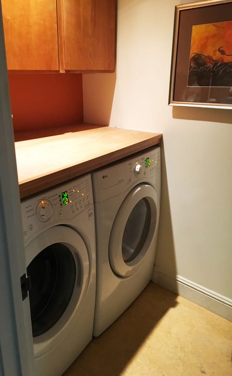 Separate laundry room with front loading quiet machines