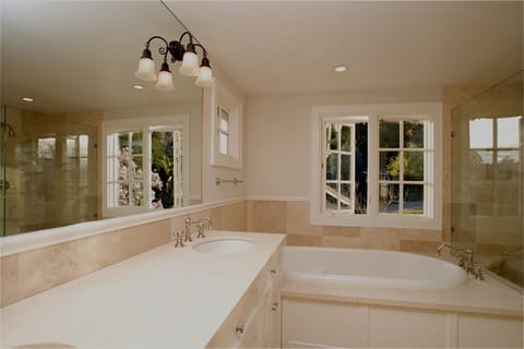Master bath with double sinks, jacuzzi tub, glass enclosed shower